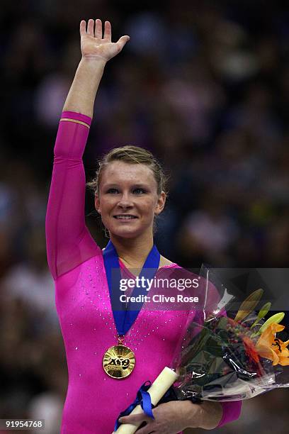 Bridget Sloan of USA celebrates with her medal after she won gold during the Women's All Round Final on the fourth day of the Artistic Gymnastics...