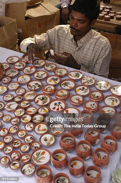 Decorative Diwali candles and diyas at a Diwali Mela.