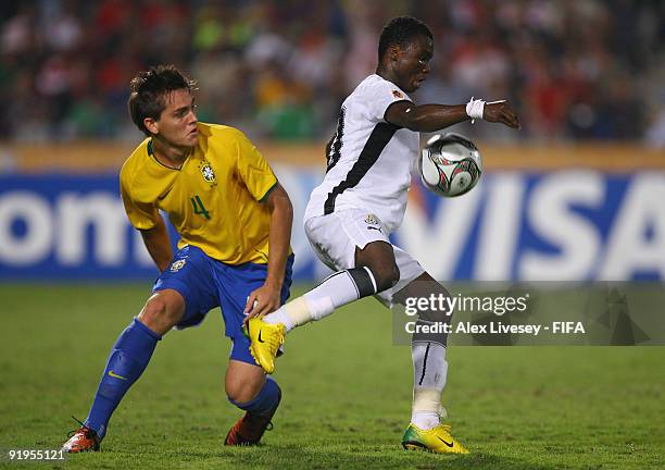 Dominic Adiyiah of Ghana shields the ball from Rafael Toloi of Brazil during the FIFA U20 World Cup Final between Ghana and Brazil at the Cairo...