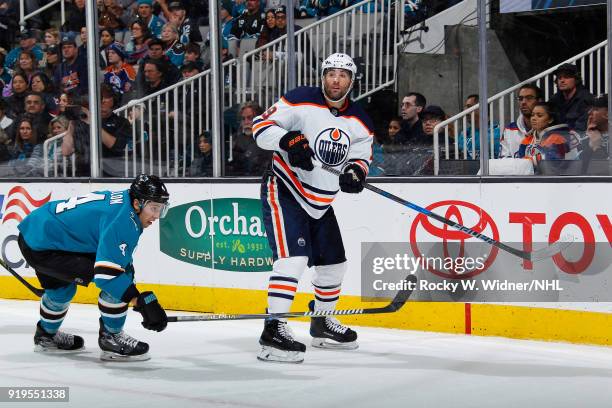 Patrick Maroon of the Edmonton Oilers clear sthe puck against Brenden Dillon of the San Jose Sharks at SAP Center on February 10, 2018 in San Jose,...