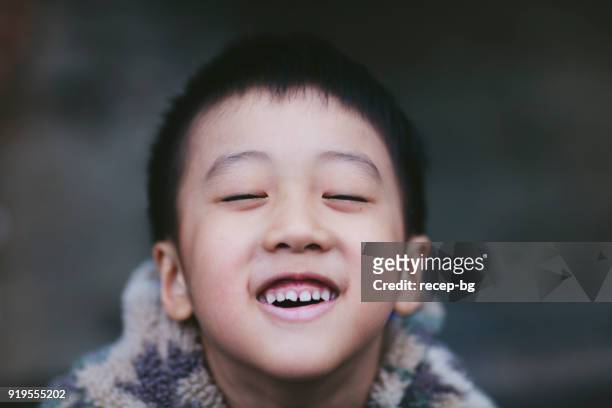 happy asian child smiling - kid eyes closed stock pictures, royalty-free photos & images