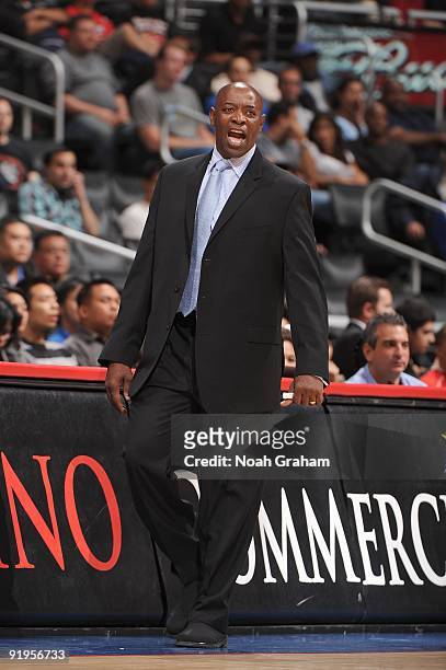 Assistant coach Keith Smart of the Golden State Warriors shouts from the sideline during the preseason game against the Los Angeles Clippers at...