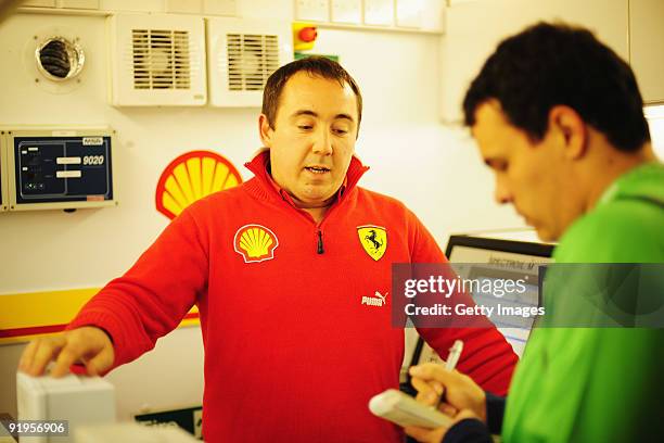 Gareth Lowe of Shell shows guests around the Shell Track Lab during practice for the Brazilian Formula One Grand Prix at the Interlagos Circuit on...