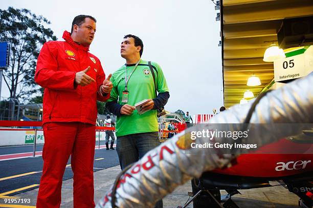 Stuart Humm of Shell shows guests around the Shell Track Lab during practice for the Brazilian Formula One Grand Prix at the Interlagos Circuit on...