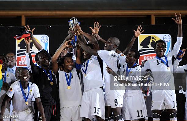 Ghana captain Andre Ayew holds up the trophy with team-mates during the FIFA U20 World Final match between Ghana and Brazil at the Cairo...