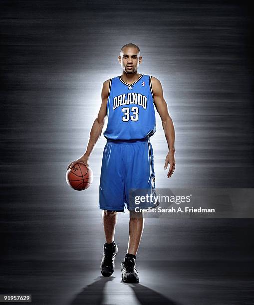 Basketball player Grant Hill poses at a portrait session in 2005.