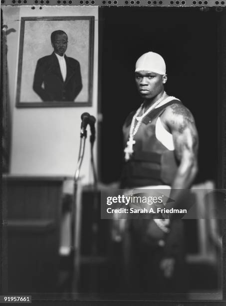 Rapper 50 Cent poses at a portrait session for One World Magazine in 2003.