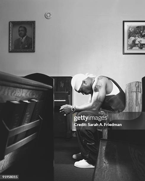 Rapper 50 Cent poses at a portrait session for One World Magazine in 2003.