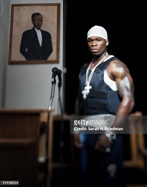 Rapper 50 Cent poses at a portrait session for One World Magazine in 2003.