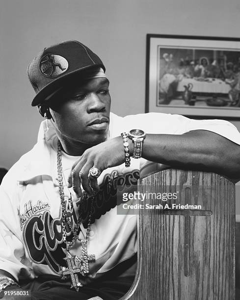 Rapper 50 Cent poses at a portrait session for One World Magazine in 2003.