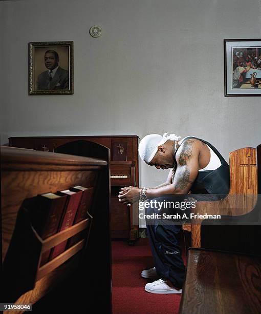 Rapper 50 Cent poses at a portrait session for One World Magazine in 2003.