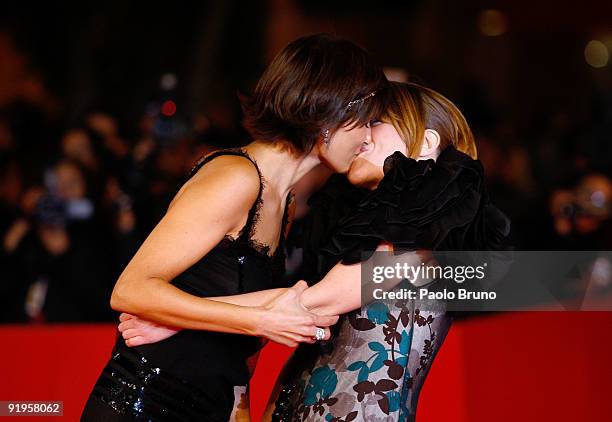 Valeria Solarino kisses Isabella Ragonese as they attend the 'Viola Di Mare' Premiere during day 2 of the 4th Rome International Film Festival held...