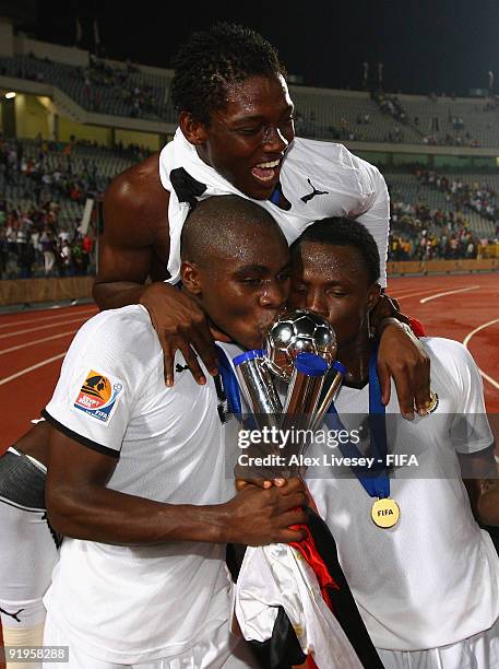 Opoku Agyemang, Daniel Opare and Samuel Inkoom of Ghana celebrate with the FIFA U20 World Cup after victory over Brazil in the FIFA U20 World Cup...