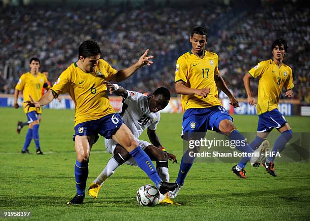 Diogo and Souza of Brazil challenge Dominic Adiyiah of Ghana during the FIFA U20 World Final match between Ghana and Brazil at the Cairo...