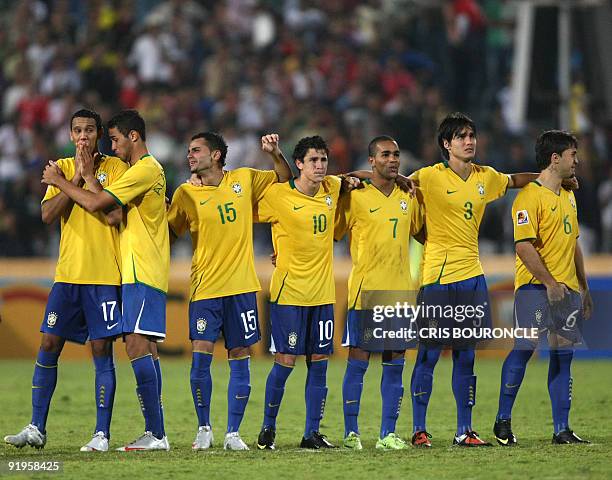 Brazil's players react after missing a penalty shot during their FIFA U-20 World Cup final football match against Ghana in Cairo on October 16, 2009....