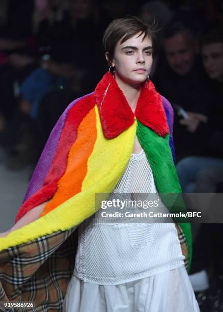 Model Cara Delevingne walks the runway at the Burberry show during London Fashion Week February 2018 at Dimco Buildings on February 17, 2018 in...