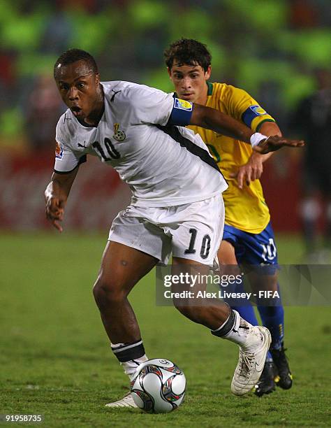 Andre Ayew of Ghana beats Giuliano of Brazil during the FIFA U20 World Cup Final between Ghana and Brazil at the Cairo International Stadium on...