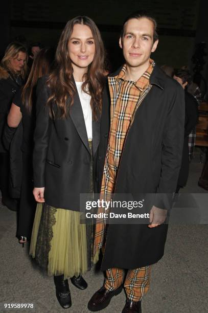 Keira Knightley and James Righton wearing Burberry at the Burberry February 2018 show during London Fashion Week at Dimco Buildings on February 17,...