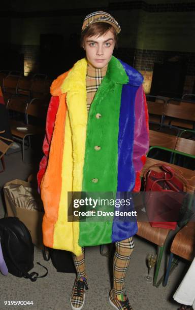 Cara Delevingne wearing Burberry at the Burberry February 2018 show during London Fashion Week at Dimco Buildings on February 17, 2018 in London,...