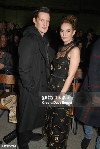 Matt Smith and Lily James wearing Burberry at the Burberry February 2018 show during London Fashion Week at Dimco Buildings on February 17, 2018 in...