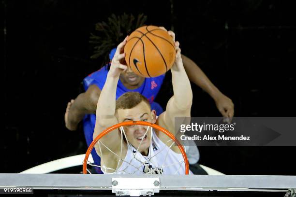 Rokas Ulvydas of the UCF Knights attempts a slam dunk over Elijah Landrum of the Southern Methodist Mustangs during a NCAA basketball game at the CFE...