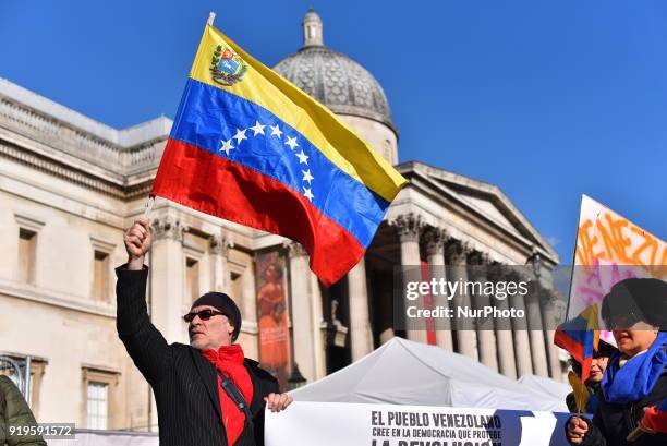 People gathered waving Vemezuelan flags to protest in support of Venezuelas president, Nicolas Maduro and against the media, at Trafalgar Square,...