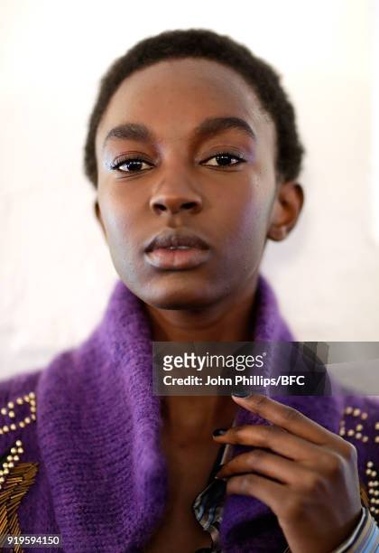 Model backstage ahead of the House of Holland show during London Fashion Week February 2018 at TopShop Show Space on February 17, 2018 in London,...