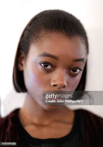 Model backstage ahead of the House of Holland show during London Fashion Week February 2018 at TopShop Show Space on February 17, 2018 in London,...