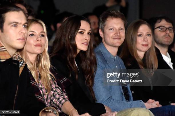 James Righton, Sienna Miller, Keira Knightley, Simon Woods, Chelsea Clinton and Marc Mezvinsky wearing Burberry at the Burberry February 2018 show...