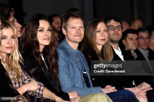 Sienna Miller, Keira Knightley, Simon Woods, Chelsea Clinton and Marc Mezvinsky wearing Burberry at the Burberry February 2018 show during London...