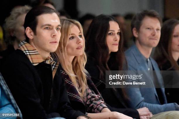 James Righton, Sienna Miller, Keira Knightley and Simon Woods wearing Burberry at the Burberry February 2018 show during London Fashion Week at Dimco...