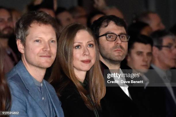 Simon Woods, Chelsea Clinton and Marc Mezvinsky wearing Burberry at the Burberry February 2018 show during London Fashion Week at Dimco Buildings on...