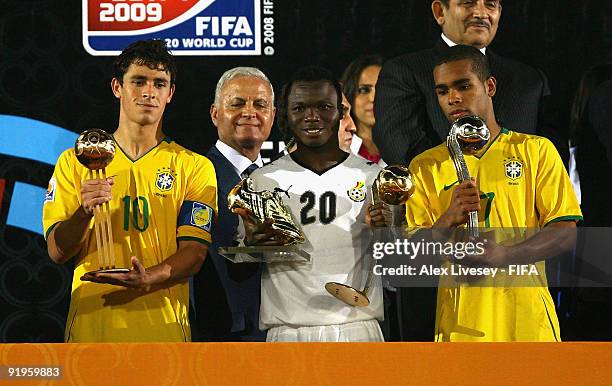 Dominic Adiyiah of Ghana wins the adidas Golden Ball Award for outstanding player of the competition, Alex Teixeira of Brazil wins the adidas Silver...