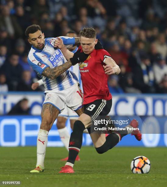 Scott McTominay of Manchester United in action with Danny Williams of Huddersfield Town during the Emirates FA Cup Fifth Round match between...