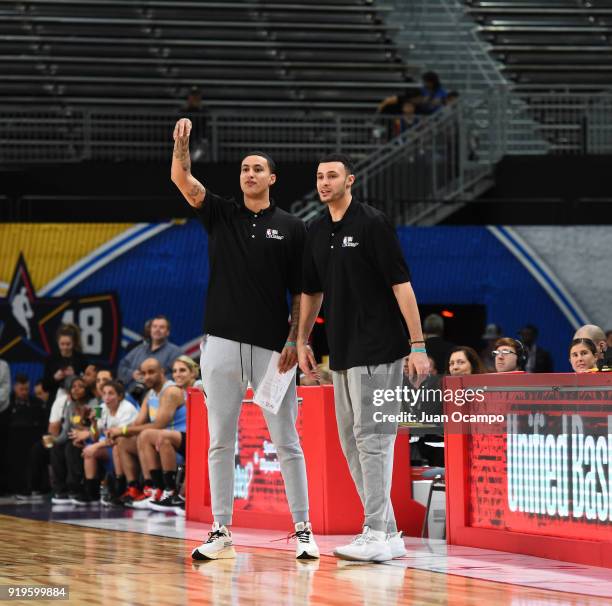 Larry Nance Jr. Of the Cleveland Cavaliers and Kyle Kuzma of the Los Angeles Lakers reacts during the 2018 NBA Cares Unified Basketball Game as part...