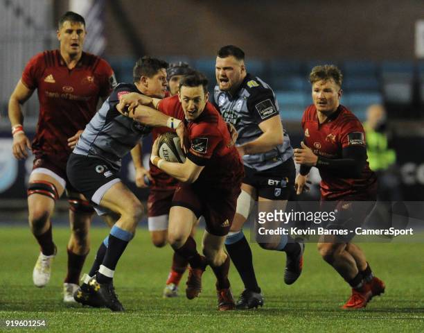 Munsters Darren Sweetnam is tackled by Cardiff Blues' Lloyd Williams during the Guinness Pro14 Round 15 match between Cardiff Blues and Munster Rugby...