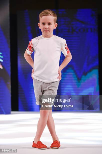 Models walk the runway for Camellia Couture at the House of iKons show during London Fashion Week February 2018 at Millenium Gloucester London Hotel...