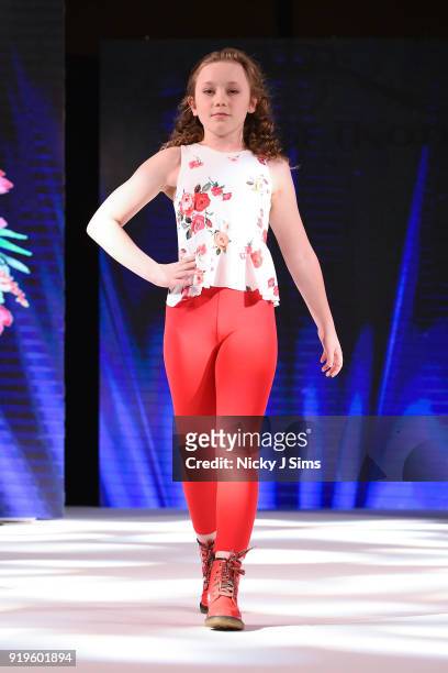 Models walk the runway for Camellia Couture at the House of iKons show during London Fashion Week February 2018 at Millenium Gloucester London Hotel...