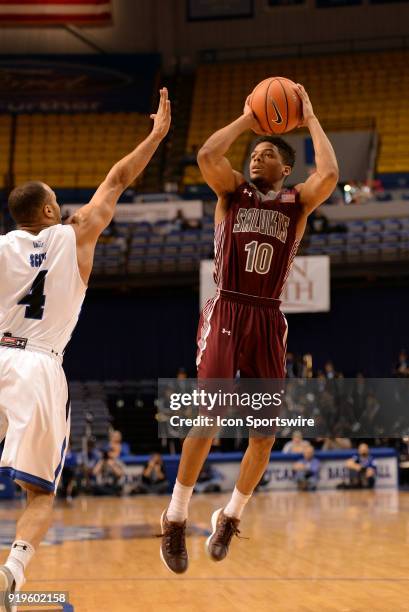 Southern Illinois Salukis guard Aaron Cook shoots an off balanced jump shot during the Missouri Valley Conference college basketball game between the...