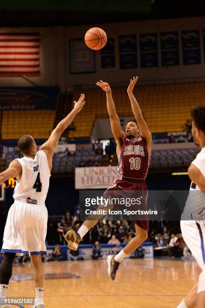 Southern Illinois Salukis guard Aaron Cook shoots an off balanced jump shot during the Missouri Valley Conference college basketball game between the...