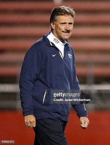 Head Coach Dave Wannstedt of the University of Pittsburgh Panthers watches his team warmp up on October 16, 2009 at Rutgers Stadium in Piscataway,...