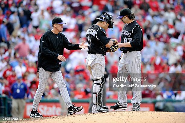 Manager Jim Tracy of the Colorado Rockies takes relief pitcher Joe Beimel out of the game in the bottom of the sixth inning against the Philadelphia...