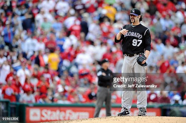 Joe Beimel of the Colorado Rockies looks on after he gave up an RBI single to Raul Ibanez of the Philadelphia Phillies in the bottom of the sixth...