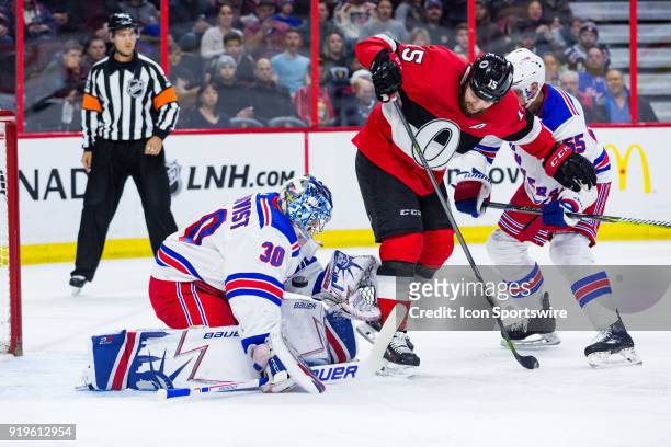 New York Rangers Goalie Henrik Lundqvist battles Ottawa Senators Left Wing Zack Smith to make a save during first period National Hockey League...