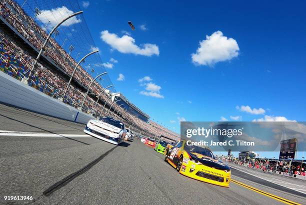 Daniel Hemric, driver of the South Point Hotel & Casino Chevrolet, and Kyle Larson, driver of the DC Solar Chevrolet, drive on a pace lap during the...