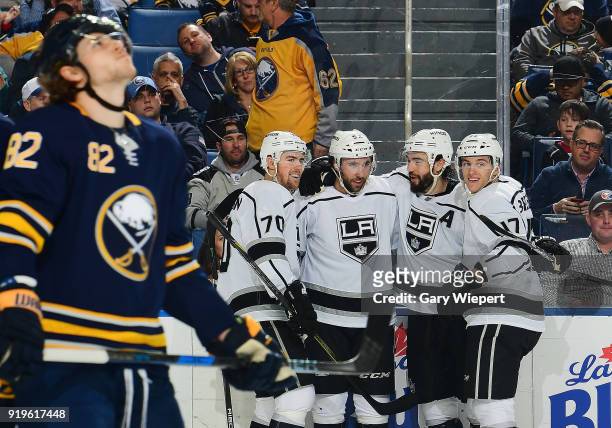 Michael Amadio of the Los Angeles Kings celebrates his goal in the second period with teammates as Nathan Beaulieu of the Buffalo Sabres reacts...