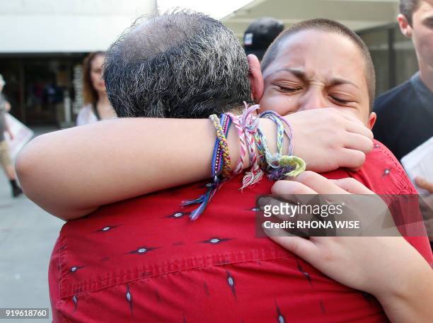 Marjory Stoneman Douglas High School student Emma Gonzalez hugs her father Jose after speaking at a rally for gun control at the Broward County...