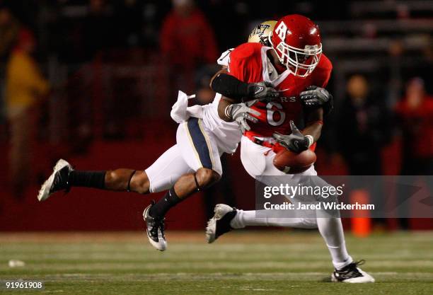 Mohamed Sanu of the Rutgers University Scarlett Knights fumbles the ball after his catch in the 4th quarter against the University of Pittsburgh...