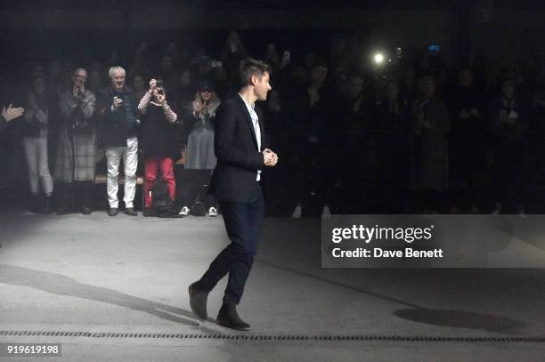 Designer Christopher Bailey salutes the crow following the Burberry February 2018 show during London Fashion Week at Dimco Buildings on February 17,...