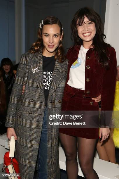 Alexa Chung and Daisy Lowe attends the House of Holland show during London Fashion Week February 2018 at TopShop Show Space on February 17, 2018 in...